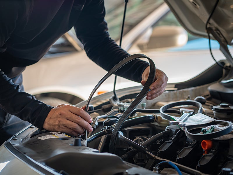 Service Technician Changing car belt